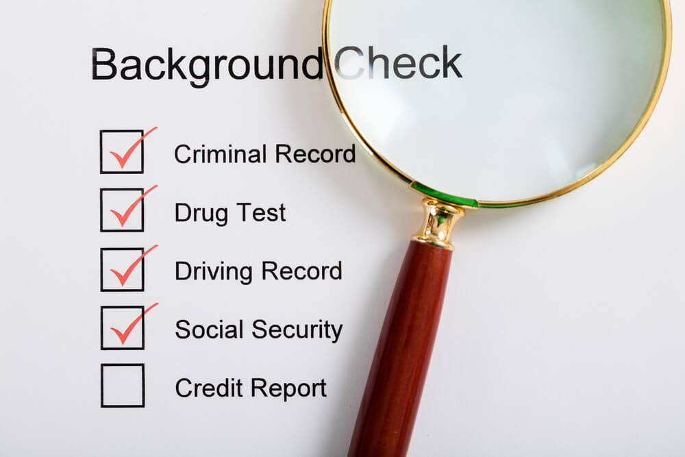 Background check checklist showing criminal record, drug test, driving record and social security checks